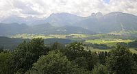 View of neighbouring Falkenstein Castle and the Tannheim Mountains