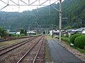 A view of the tracks at the station, looking south. The siding can be seen branching off to the left.