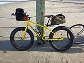 TommiSea Fat Sand Bike equipped for long-distance beach trekking, photographed at the Virginia-North Carolina border.