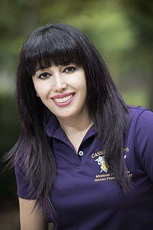 Professional headshot of woman smiling at camera