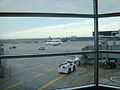 At Terminal 3 of Toronto Pearson International Airport (ICAO: CYYZ; IATA: YYZ; our flight is the Northwest Airlink Bombardier CRJ200 hidden by the jet bridge in the foreground.