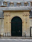 Two pairs of Ionic pilasters flanking a door in Paris