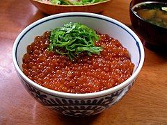 Ikura-don with green shiso garnish