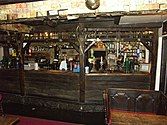 Bar area, with currency on the walls