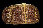 Shoulder-clasps from Sutton Hoo; early 7th century; gold, glass and garnet; length: 12.7 centimetres (5.0 in); British Museum (London)