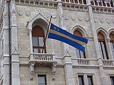 Székely flag flying above the Hungarian Parliament Building, Budapest