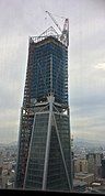 Feb 1, 2017 - Installation of roof decorative structure in progress, window glass significantly complete on office floors.