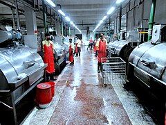 Socks dyeing machine in a washing plant for washing jeans