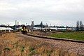 A Class 153 operated by Abellio Greater Anglia leaving Ely Dock Junction on a service to Ipswich with the ex-GER mainline in the background and Ely Cathedral on the skyline