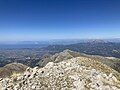 The bridge is visible from incredible distances. It is just observable from the top of Mount Erymanthos, Olenos Peak. Distance is about 21 miles.