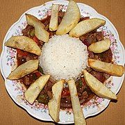 Lomo saltado with fries on top