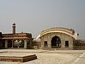 Wider view of the quadrangle, minarets of Badshahi Mosque visible in background