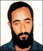 The face of a Palestinian man with a black beard.