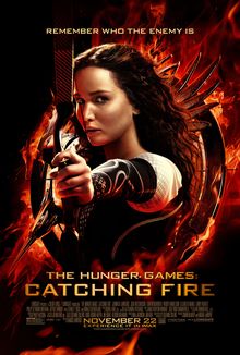 A girl holding a bow, pulling back an arrow, in a fiery circle against a black background.