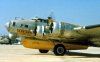 Modified B-17 Flying Fortress bomber, carrying a yellow lifeboat, serving as a Dumbo rescue flight