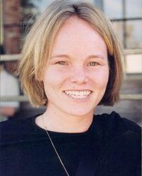 A smiling Caucasian woman with blond hair