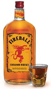 A bottle and a glass of Fireball Cinnamon Whiskey