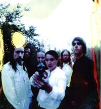 The last active incarnation of the band. From left to right: Paul Thompson, Steven Robinson, Shawn Crahan, Dorothy Hecht, Wade Thompson, Jarrod Brom