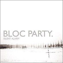 Mostly white album cover with winter image of grey tree line in distance, captioned "BLOC PARTY." and (much smaller) "SILENT ALARM" below it.