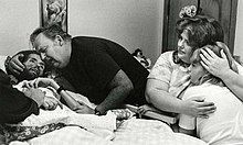 David Kirby on his deathbed, surrounded by his family.