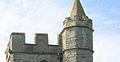 MERLONS, PARAPET: The square tower of St. Andrews church is topped with a crenellated wall -- a protective barrier also called a PARAPET. The cut-out portions of the wall, the crenules, were designed for military defense, allowing a view and a shot through otherwise thick, protective walls. MERLONS are the solid blocks of the parapet. Because this type of tower was designed for defense, it it known as an EMBATTLED parapet. The octagonal external STAIR TURRET next to the tower encloses a spiral staircase.