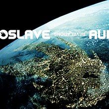 An angled view of a blue planet from space with a landmass shaped like Audioslave's flame logo