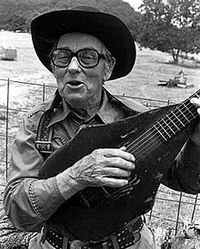 Driftwood posing with his unusual guitar