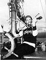 Myron Spaulding playing violin aboard Odyssey