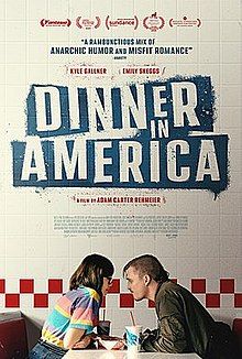 A poster featuring a couple about to kiss at a restaurant.