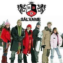 Dulce, Alfonso, Maite, Christopher, Christian and Anahí wearing winter gear and standing in a line with a snow-filled background. The song's name and the group's logo appear above them.