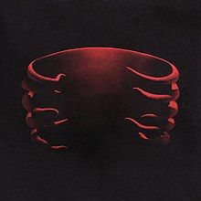 Cover art for Undertow, featuring a red 3D model of a ribcage designed by Adam Jones