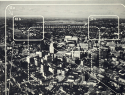 Photograph of downtown Rochester shows two of the scene plots used in the film: a zoom to horizon and pan across, and a street-corner zoom from medium close-up. Verticals, diagonal pans, up-zooms and other combinations were used to abstract several scenes from a few 4X5 color transparencies taken by aerial photographer---effectively simulating smooth helicopter and aircraft cinematography at a fraction of the cost.