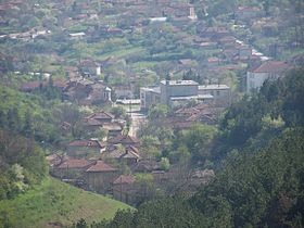 A view of the center of Katselovo, BG from the hillside to the North. Showing the Church tower (center left), the Cultural Center (large grey building) and what was the school (center right).