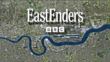 A satellite image of a city with a winding river in blue in the bottom half of the image. In the top half are the words "EastEnders" and "BBC" in white.