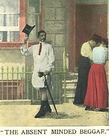 Man in a shirt and tie, with a fancy cane but no trousers tips his top hat.