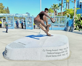 Bronze sculpture of Sandy Koufax on a granite base