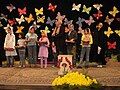 In a special ceremony, the children with the best marks in school receive presents